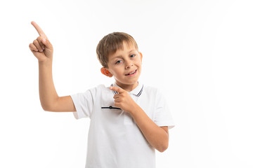 Young caucasian teenager points a fingers at something on white background