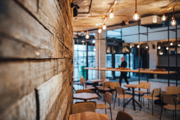 View on wooden wall and coffee shop in blurred background