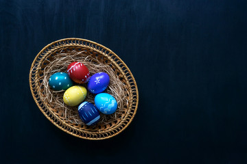 Multi-colored easter paint eggs in pottle. Easter.