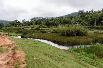 Obraz premium People washing their clothes in a small lake in the Usambara mountains