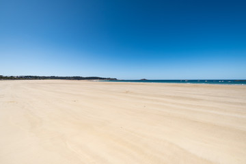 Fototapeta premium Large sandy beach in the town of 