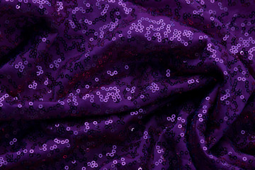 Purple fabric with sequins texture background