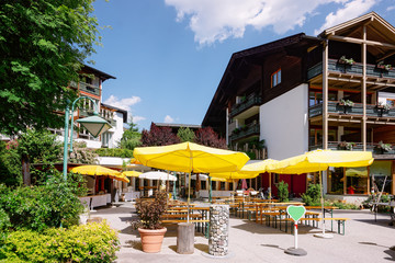 Street restaurant with umbrellas tables and chairs at Bad Kleinkirchheim