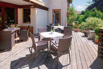 Fototapeta na wymiar Street restaurant and tables and chairs of Bad Kleinkirchheim Austria