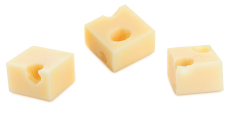 Portions (cubes, dice) of Emmental Swiss cheese. Texture of holes and alveoli. Isolated on white background