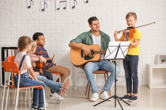 Teacher Giving Music Lessons At School