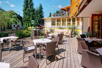 Street restaurant with tables and chairs Bad Kleinkirchheim Austria