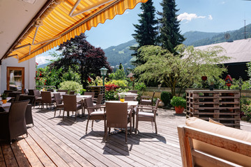 Street restaurant with tables chairs in Bad Kleinkirchheim Austria