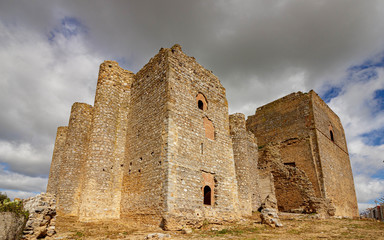 Remains of the castle in Villagarcia de la Torre seen from below at wide angle