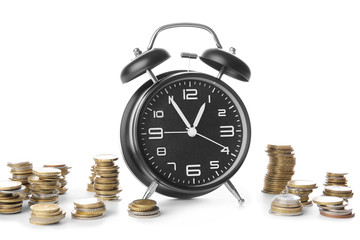Alarm clock and coins on white background. Time management concept