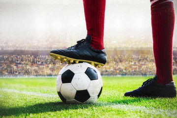 soccer player standing with soccer ball kick off in the stadium - obrazy, fototapety, plakaty
