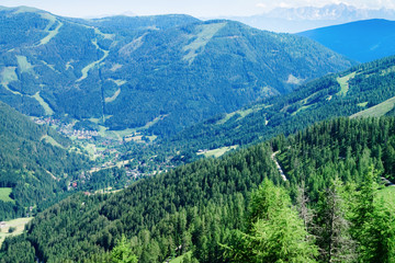 Fototapeta na wymiar Panoramic view of mountains and blue sky in Bad Kleinkirchheim at Austria