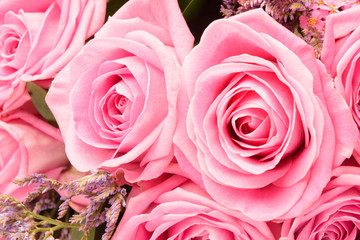 Closeup view of pink roses bouquet. Holiday beautiful flowers background