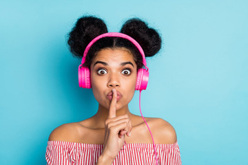 Shh. My favorite song. Closeup photo of funny dark skin lady listen music modern earphones hold...