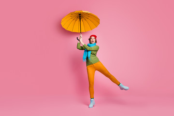 Omg parasol fly away. Full size photo of amazed girl try catch her bright umbrella feel fear stare...