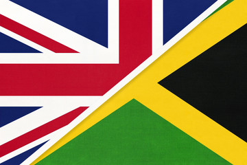 United Kingdom vs Jamaica national flag from textile. Relationship between two european and american countries.