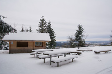 Winter barbecue area with snow in Black Forest