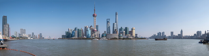 Fototapeta na wymiar Cityscape of Shanghai at daytime. Panoramic view of Pudong's skyline from the Bund. Located in Waitan. One of the most famous tourist destinations in Shanghai.