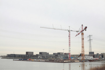 Fototapeta na wymiar Construction of new luxury house on a water in Amsterdam
