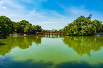 Fototapeta na wymiar Morning Sunlight Bridge on Hoan Kiem lake, Hanoi Old Quarter, Vietnam
