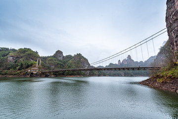 A cable bridge across the lake