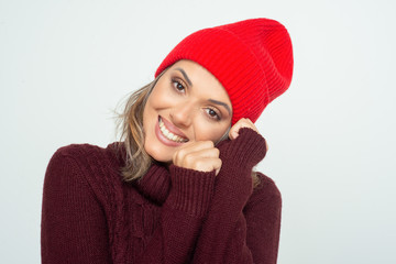 Beautiful happy woman in red hat. Portrait of beautiful young blonde woman in knitted hat and...