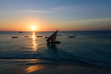 Sunset over a fisher boat at the  West coast of Sansibar, East Africa, August 2017, Tanzania