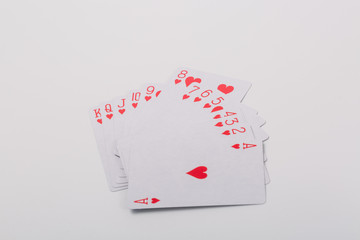 Expanded playing cards on white background