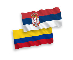 Flags of Colombia and Serbia on a white background