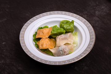 Dumplings made of vegetables of various colors are put on the plate