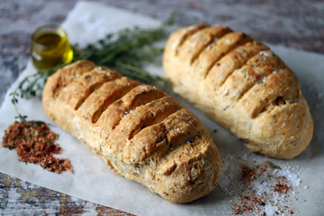 Homemade bread with Italian herbs and spices. Italian food.