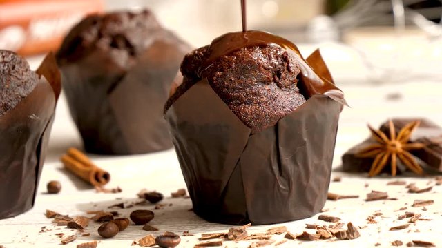chocolate muffin with chocolate sauce pouring