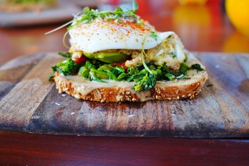 Multigrain avocado toast with fried egg on top
