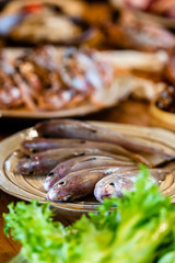 There are fish and other fresh sea ingredients in the kitchen