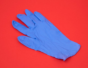 blue medical rubber glove for carrying out procedures and manipulations