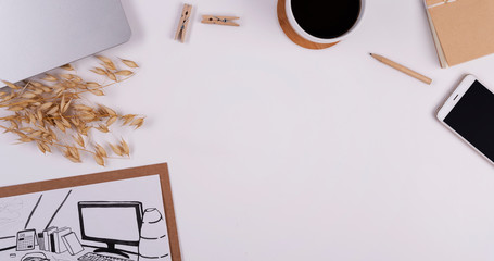 Office desk with accessories on white background with copy space. Laptop, cup of coffee and phone on the table. Business and technology for work. Flat lay.