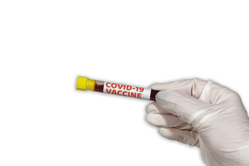 Fototapeta premium Coronavirus COVID-19 world outbreak concept with vaccine tag on vacutainer. Female chemist with protective gloves displays blood tube with Wuhan virus vaccine trial sample against white background.