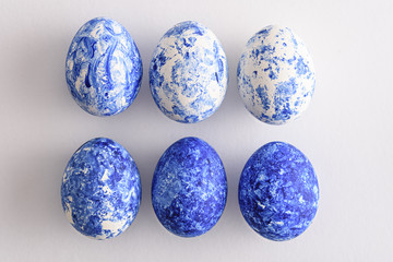 trendy six Easter eggs with classic blue gradient effect on white background