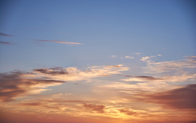 Sky with golden, orange, yellow and blue tones. Sunrise and sunset. Sky for assembly. Sunlit clouds