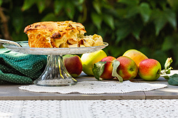 Apple pie in the summer garden. Seasonal food.