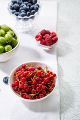 Summer berry in white bowls, local food