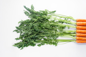 Flat lay composition with ripe fresh carrots on white background