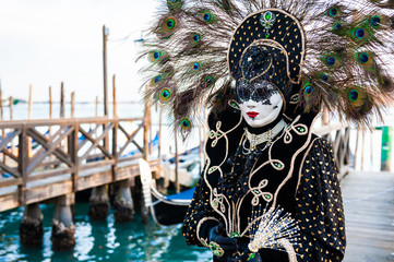 Obraz na płótnie Canvas Beautiful colorful masks at traditional Venice Carnival in February 2020 in Venice, Italy