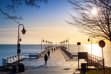 Beautiful landscape with wooden pier in Gdynia Orlowo at sunrise, Poland