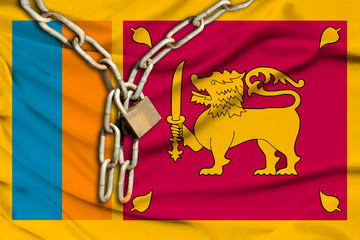 iron chain and castle on the silk national flag of Sri Lanka with beautiful folds, the concept of a ban on tourism, political repression, crime, violation of the rights and freedoms of citizens