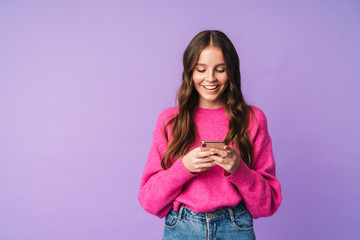 Fototapeta na wymiar Image of young beautiful woman smiling and holding cellphone