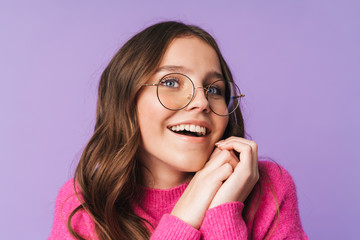 Image of young woman wearing eyeglasses smiling and looking upward