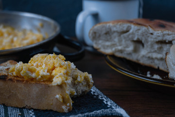 scrambled egg at breakfast with a cup of tea
