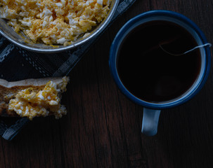 scrambled egg at breakfast with a cup of tea