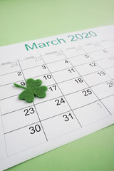 March 17 is St. Patrick's Day. The date is marked in the organizer with a clover leaf. Close-up shot.